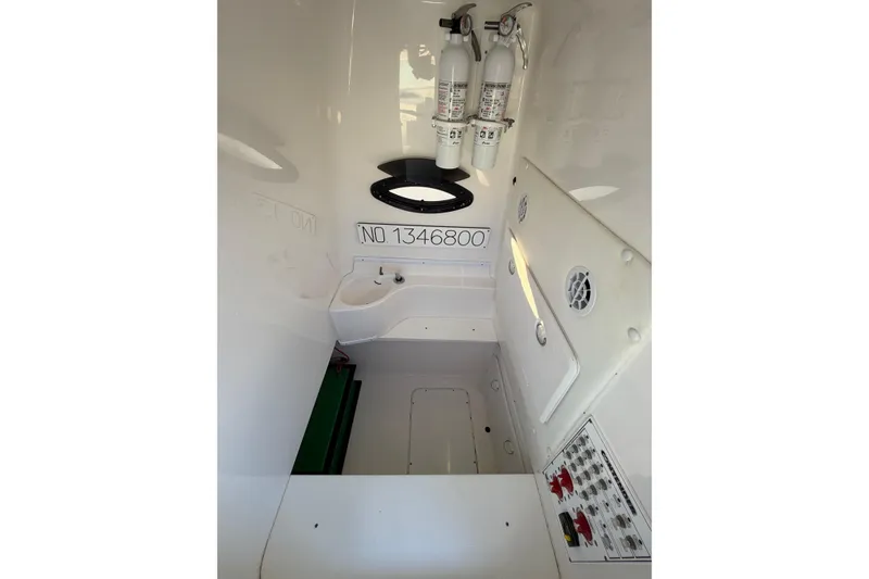 Slide: The Image of 2020 Contender 32 ST interior with fire extinguishers and control panel. - 64