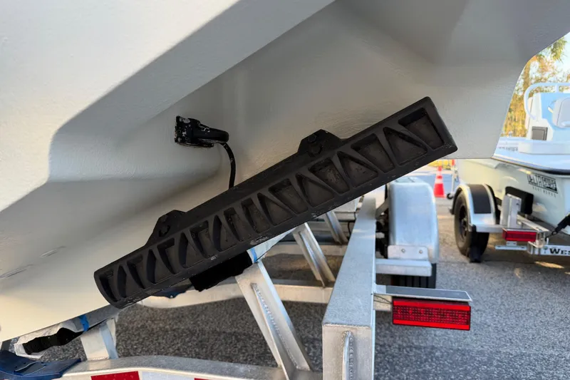 Slide: The Image of 2020 Contender 32 ST boat on trailer, showing hull and transducer detail. - 73