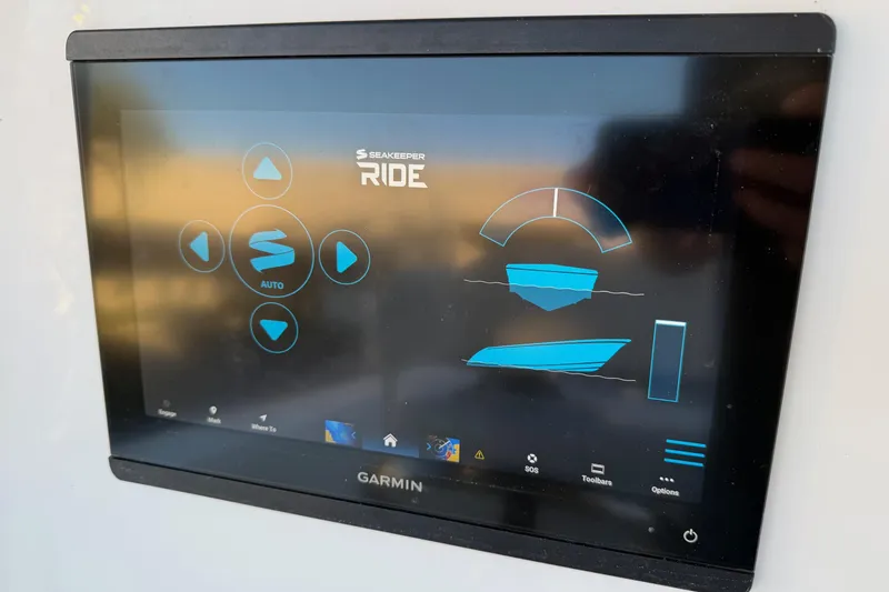 Slide: The Image of Garmin display on 2020 Contender 32 ST boat with Seakeeper Ride system interface. - 74