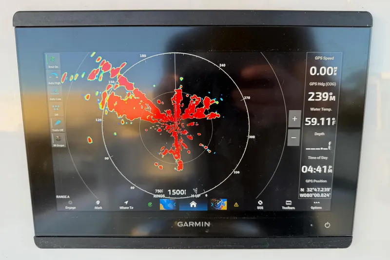 Slide: The Image of Garmin marine radar display on 2020 Contender 32 ST boat, showing navigation data. - 75