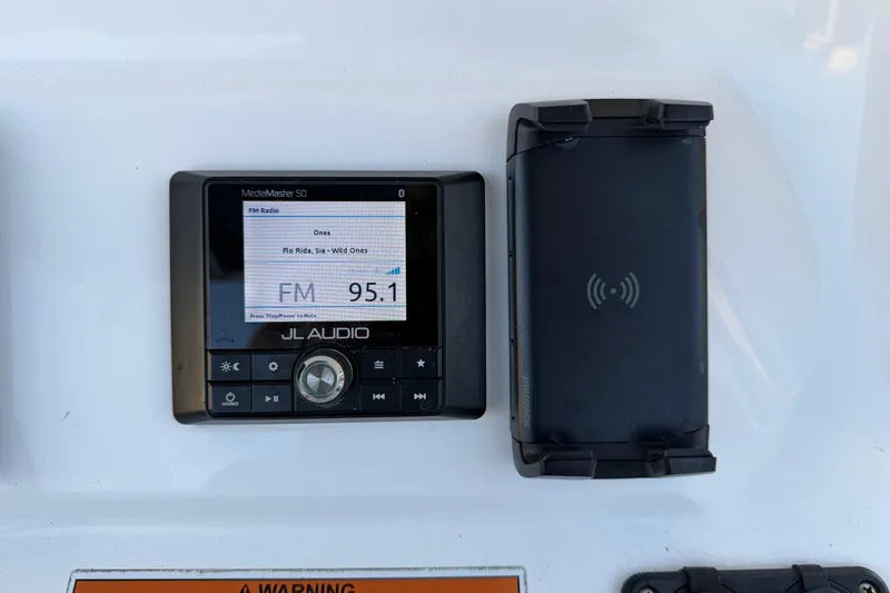 Slide: The Image of JL Audio MediaMaster display on 2020 Contender 32 ST boat, showing FM 95.1. - 79