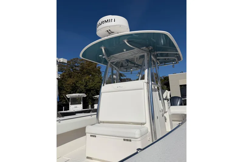 Slide: The Image of 2020 Contender 32 ST boat with Garmin radar, sleek design, and modern console. - 84