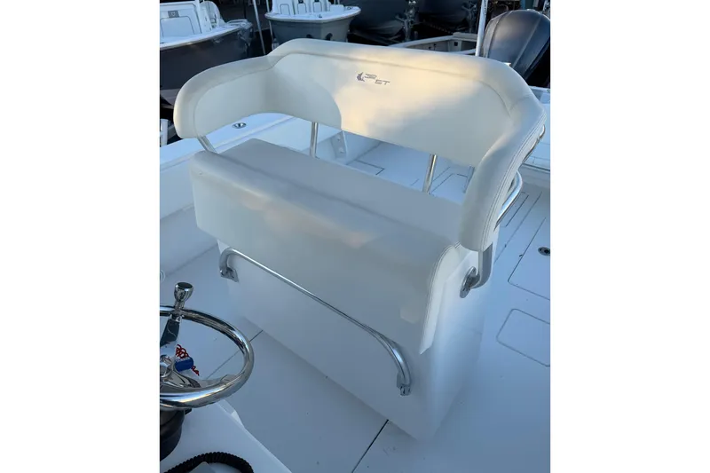 Slide: The Image of 2020 Contender 32 ST boat seat with white upholstery and stainless steel accents. - 92