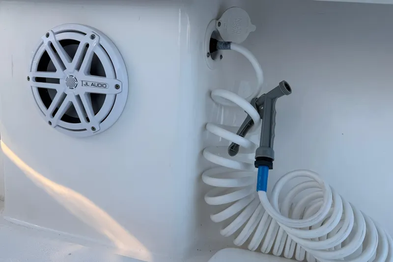 Slide: The Image of 2020 Contender 32 ST boat with JL Audio speaker and coiled hose. - 93