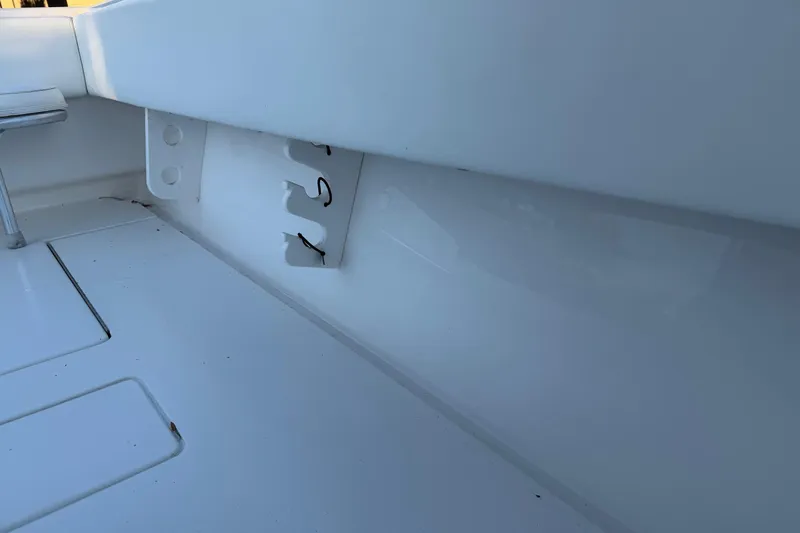 Slide: The Image of 2020 Contender 32 ST boat interior detail, showcasing sleek white design and storage features. - 96