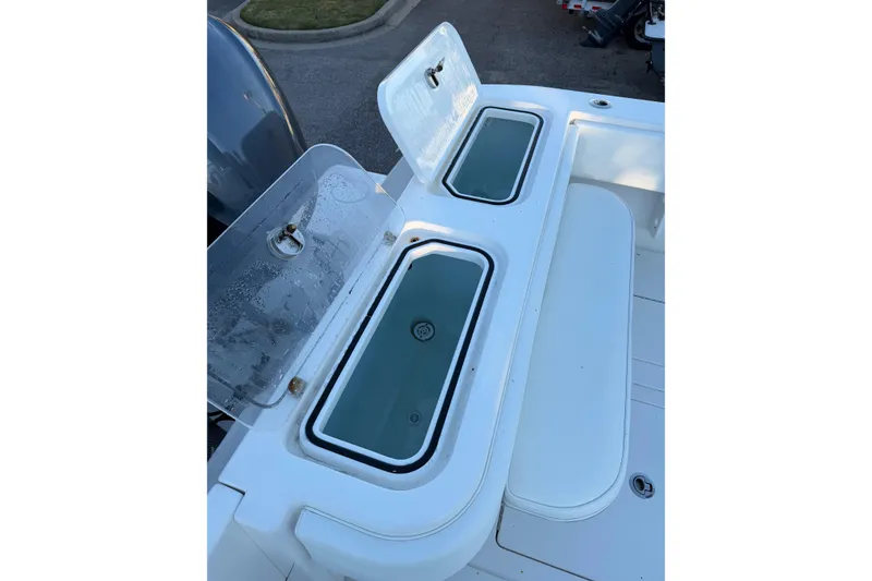 Slide: The Image of 2020 Contender 32 ST boat with open livewell compartments on deck. - 97