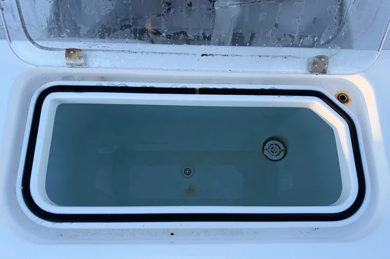 Slide: The Image of Open livewell on 2020 Contender 32 ST boat, filled with water. - 99