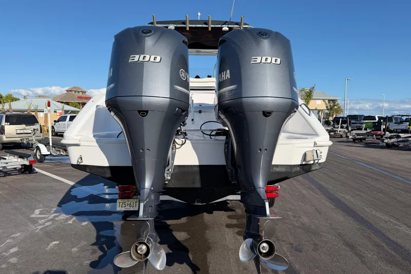 Slide: The Image of 1999 Donzi 35 ZF Cuddy with twin Yamaha 300 engines at a marina. - 4