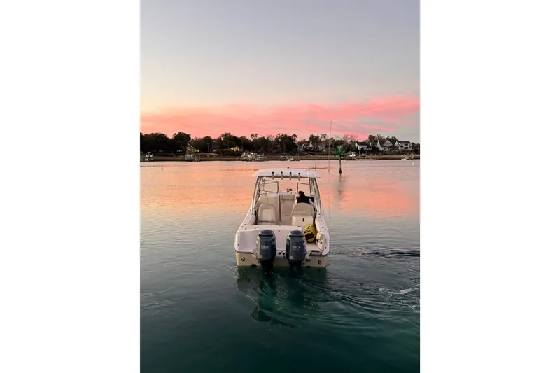 Slide: The Image of Grady-White Freedom 275 boat on serene water at sunset, 2012 model. - 14