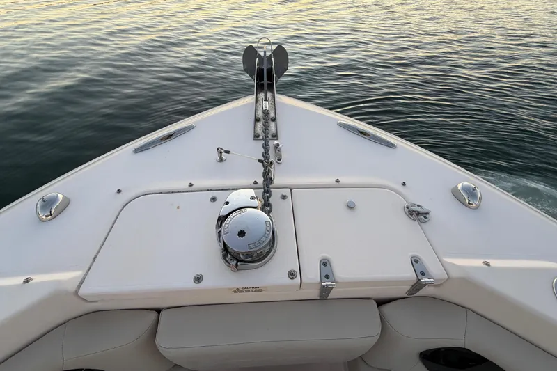 Slide: The Image of Bow of 2012 Grady-White Freedom 275 boat with anchor and calm water. - 33