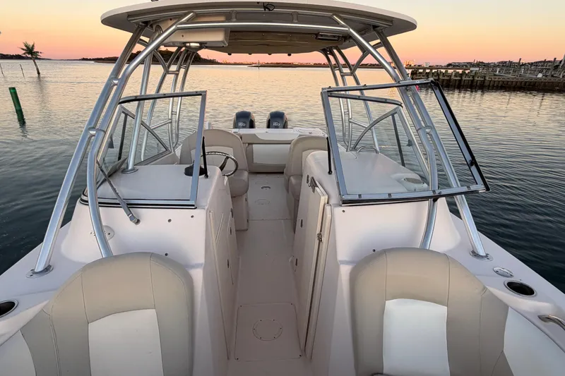 Slide: The Image of 2012 Grady-White Freedom 275 boat interior at sunset on calm water. - 34