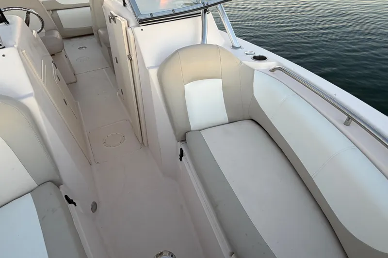 Slide: The Image of 2012 Grady-White Freedom 275 boat interior with white seating and sleek design. - 35