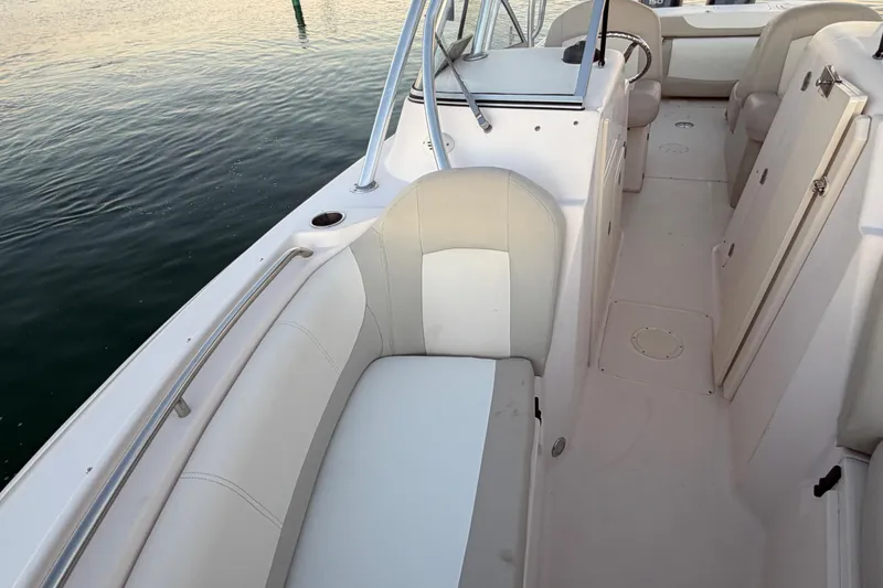 Slide: The Image of 2012 Grady-White Freedom 275 boat interior with white seating and railing. - 36