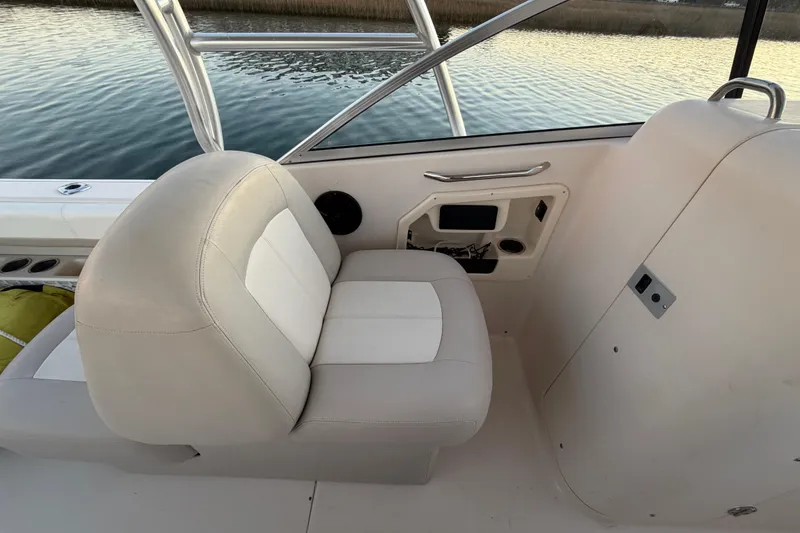 Slide: The Image of Interior seating of 2012 Grady-White Freedom 275 boat, featuring beige upholstery. - 45