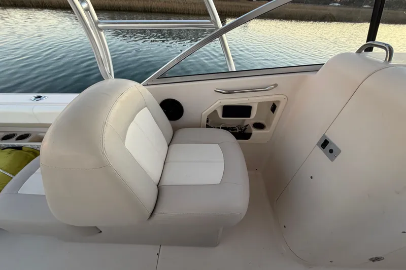 Slide: The Image of 2012 Grady-White Freedom 275 boat interior with beige seating and water view. - 46