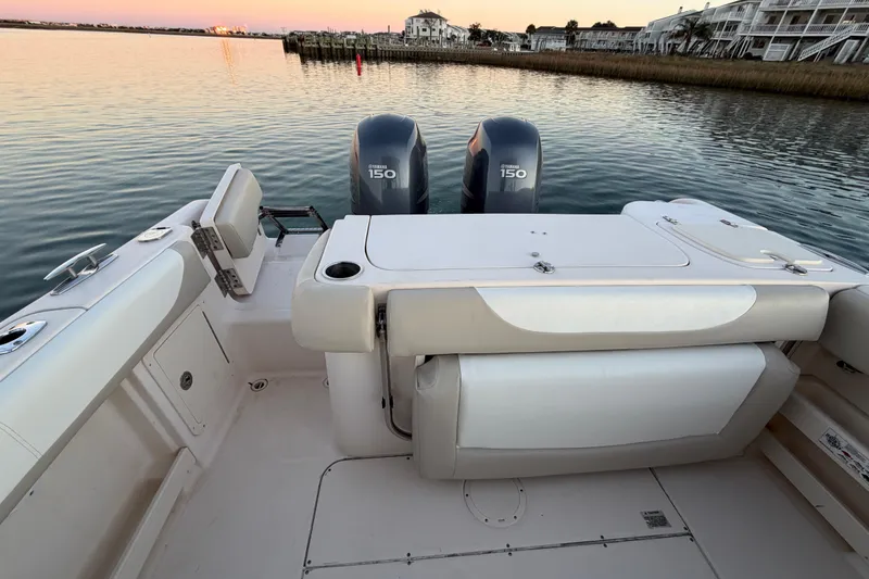 Slide: The Image of 2012 Grady-White Freedom 275 boat with twin Yamaha 150 engines at sunset. - 54