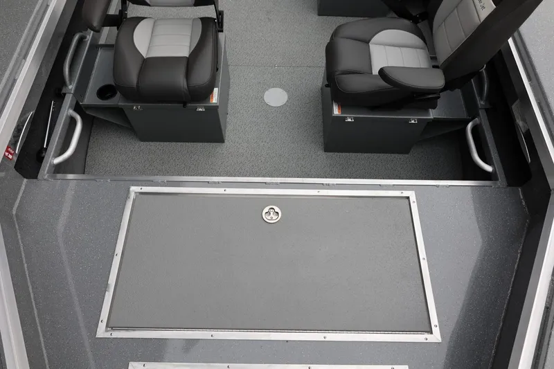 Slide: The Image of Interior of 2026 Thunder Jet 229 Rush OT boat with gray seating and flooring. - 10