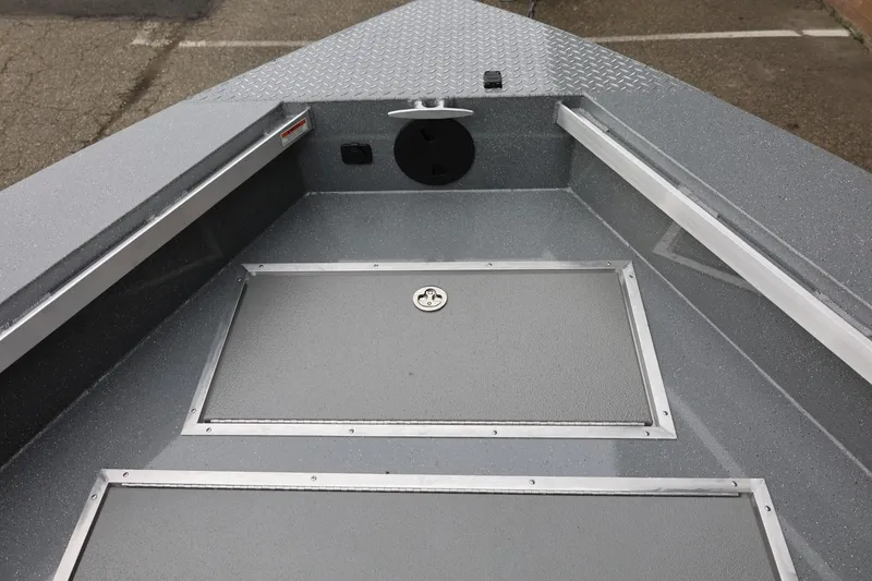 Slide: The Image of 2026 Thunder Jet 229 Rush OT boat interior with storage compartments and non-slip flooring. - 11