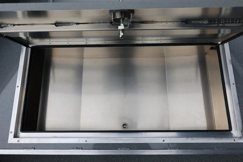 Slide: The Image of Open storage compartment of 2026 Thunder Jet 229 Rush OT boat. - 12