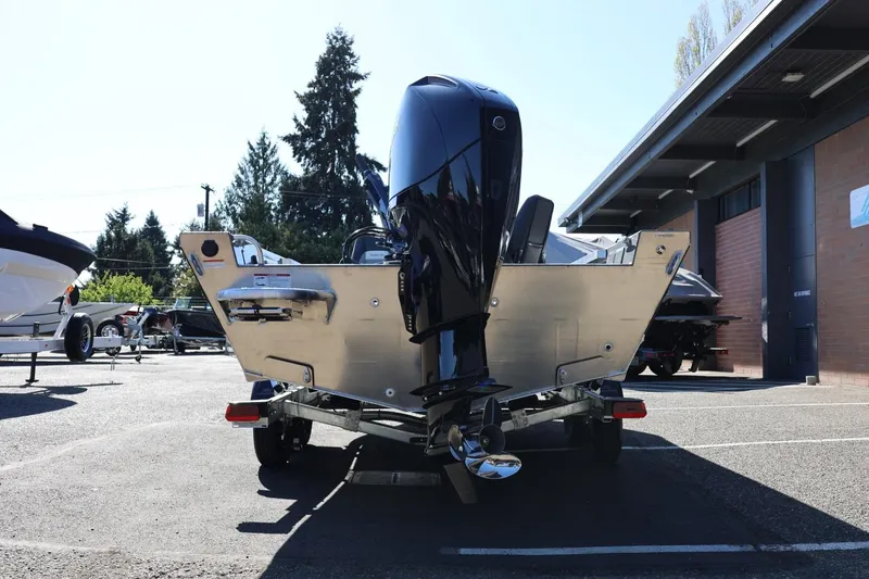 Slide: The Image of 2026 Thunder Jet 229 Rush OT boat on trailer, rear view in outdoor setting. - 24
