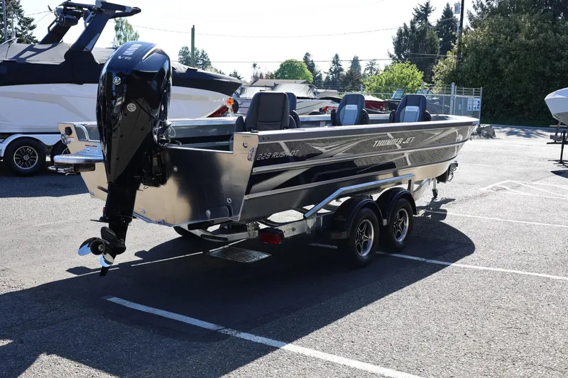 Slide: The Image of 2026 Thunder Jet 229 Rush OT boat on trailer in parking lot. - 28