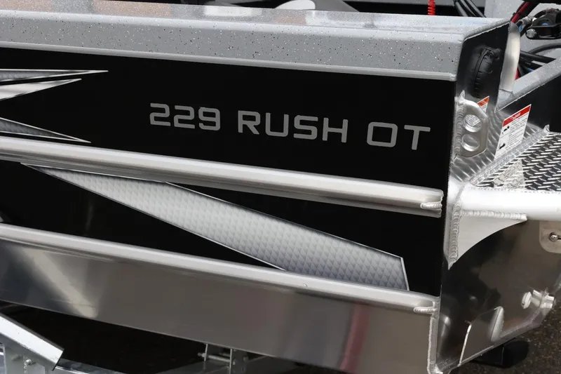 Slide: The Image of 2026 Thunder Jet 229 Rush OT boat detail with sleek design and metallic accents. - 3