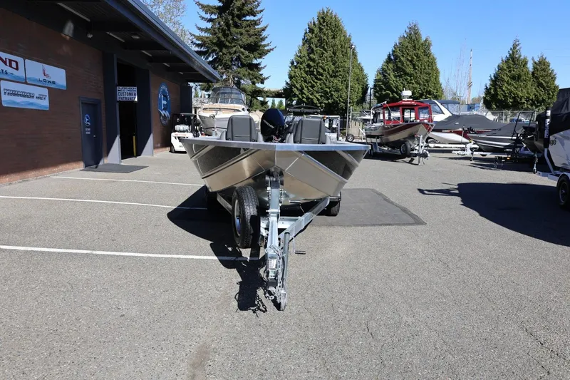 Slide: The Image of 2026 Thunder Jet 229 Rush OT boat on trailer in dealership parking lot. - 34