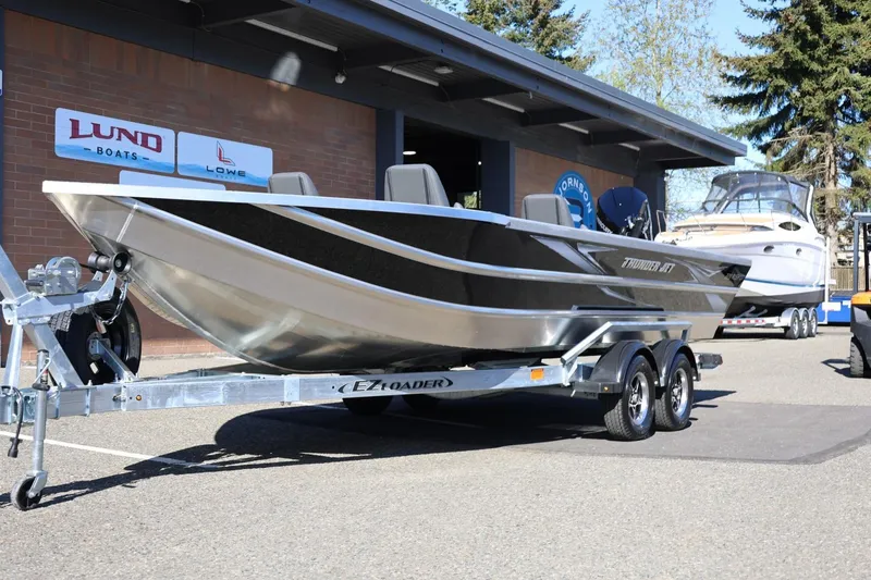 Slide: The Image of 2026 Thunder Jet 229 Rush OT boat on trailer outside dealership. - 37