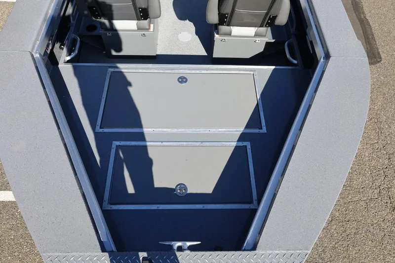 Slide: The Image of Interior view of 2026 Thunder Jet 229 Rush OT boat, featuring storage compartments and seating. - 38