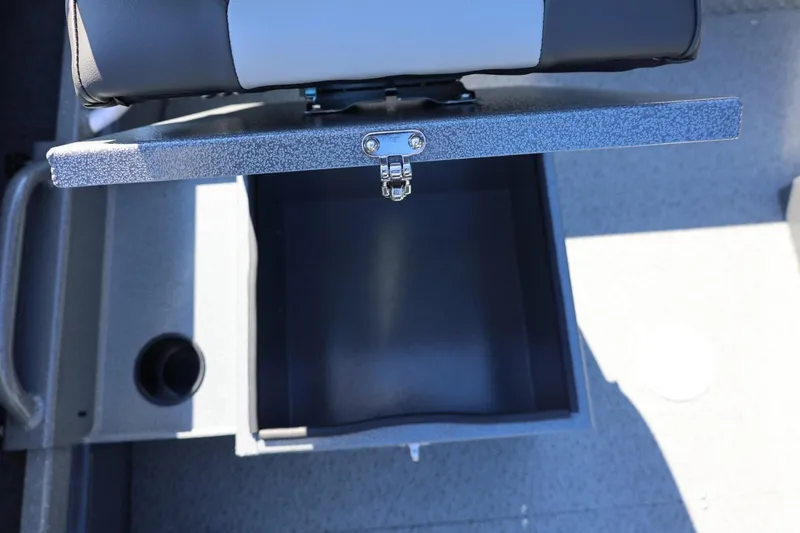 Slide: The Image of Open storage compartment in 2026 Thunder Jet 229 Rush OT boat interior. - 44