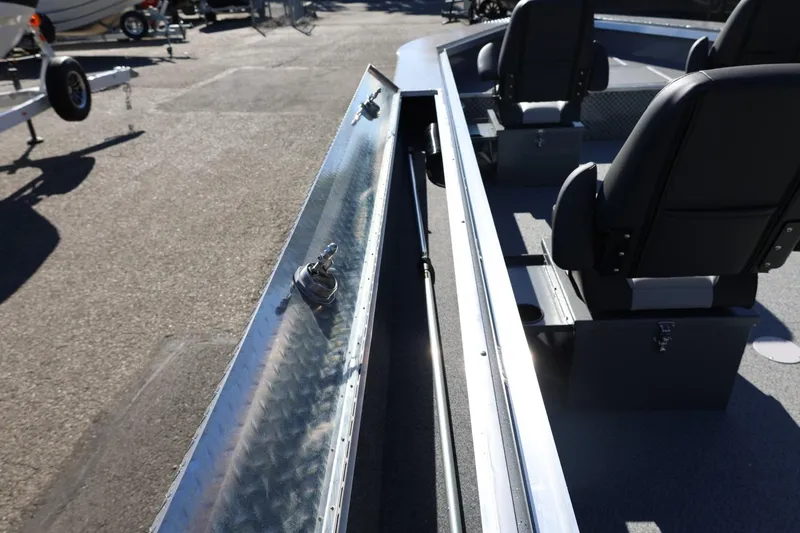 Slide: The Image of 2026 Thunder Jet 229 Rush OT boat interior with seating and storage compartments. - 49