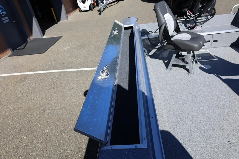 Slide: The Image of Open storage compartment on 2026 Thunder Jet 229 Rush OT boat deck. - 51