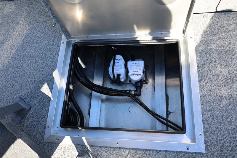 Slide: The Image of Open hatch of 2026 Thunder Jet 229 Rush OT boat showing internal components. - 54