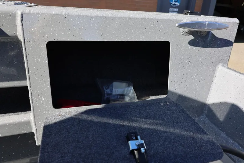 Slide: The Image of Open storage compartment on 2026 Thunder Jet 229 Rush OT boat. - 59