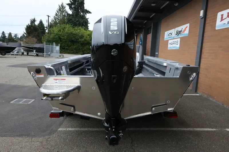 Slide: The Image of 2026 Thunder Jet 229 Rush OT boat with powerful V6 engine, parked outdoors. - 6