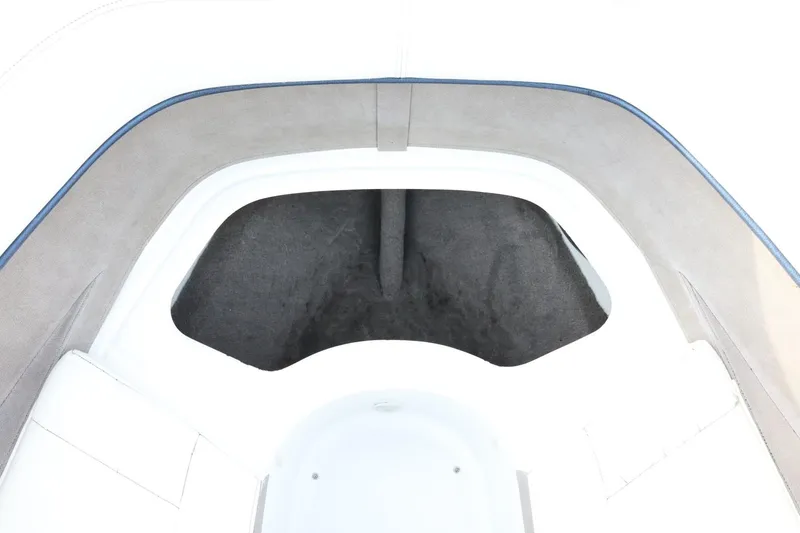 Slide: The Image of Interior view of a 2005 Cobalt 200 boat, featuring cushioned seating and storage area. - 22