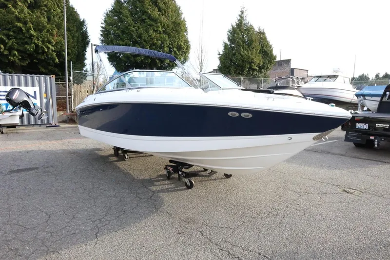 Slide: The Image of 2005 Cobalt 200 boat with blue and white exterior on a trailer. - 3