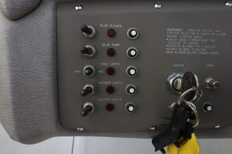 Slide: The Image of Control panel of a 2005 Cobalt 200 boat with ignition keys and switches. - 31