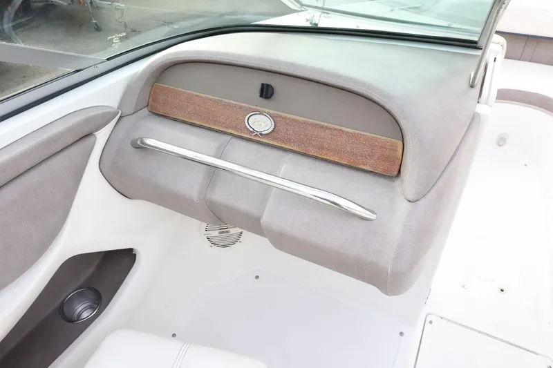 Slide: The Image of 2005 Cobalt 200 boat interior with dashboard and storage compartment. - 37