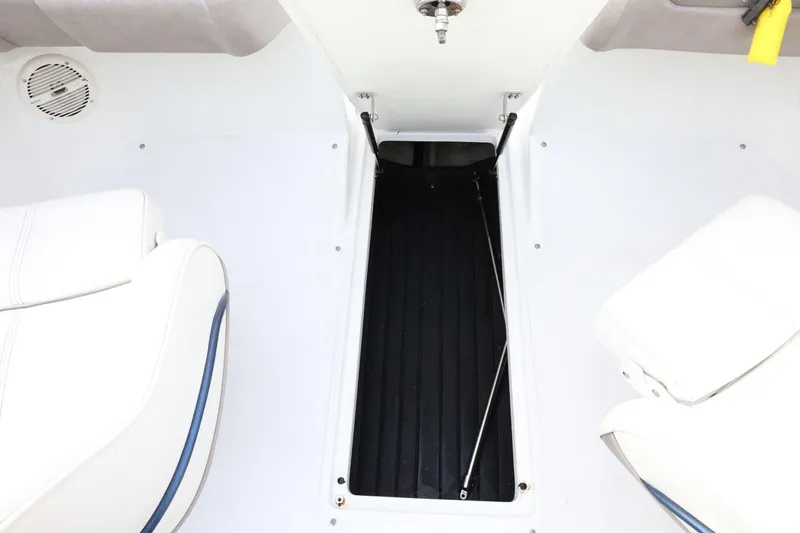 Slide: The Image of Interior of a 2005 Cobalt 200 boat showing seating and storage compartment. - 38
