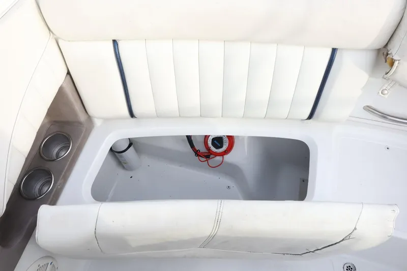 Slide: The Image of White seating area with storage compartment on a 2005 Cobalt 200 boat. - 40