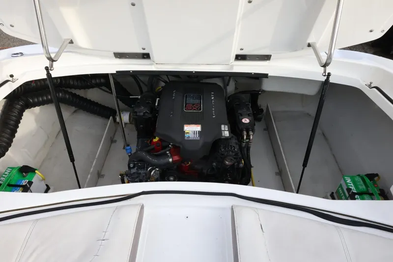 Slide: The Image of Engine compartment of a 2005 Cobalt 200 boat, showcasing the motor and components. - 42