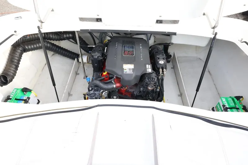 Slide: The Image of Engine compartment of a 2005 Cobalt 200 boat, featuring a powerful engine setup. - 43