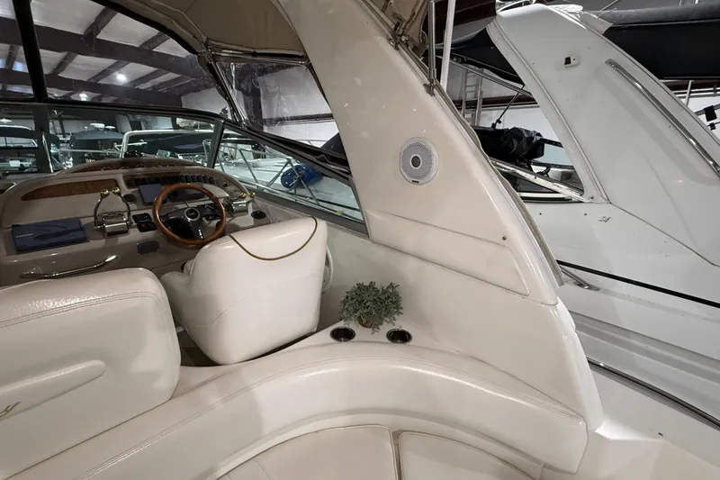 Slide: The Image of Interior of 2000 Sea Ray Sundancer 310 boat with steering wheel and seating. - 17