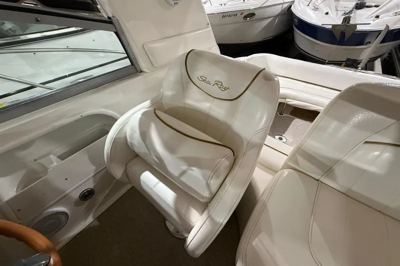 Slide: The Image of 2000 Sea Ray Sundancer 310 interior with white leather seating and elegant design. - 26
