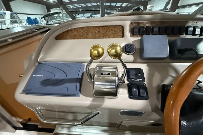 Slide: The Image of Control panel of a 2000 Sea Ray Sundancer 310 boat with navigation equipment. - 28