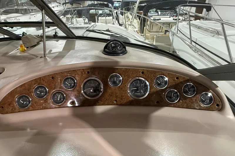 Slide: The Image of Dashboard of a 2000 Sea Ray Sundancer 310 boat with gauges and compass. - 30