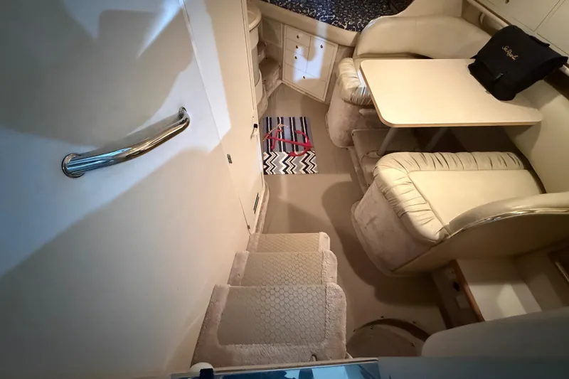 Slide: The Image of Interior of 2000 Sea Ray Sundancer 310 yacht with cozy seating and dining area. - 34