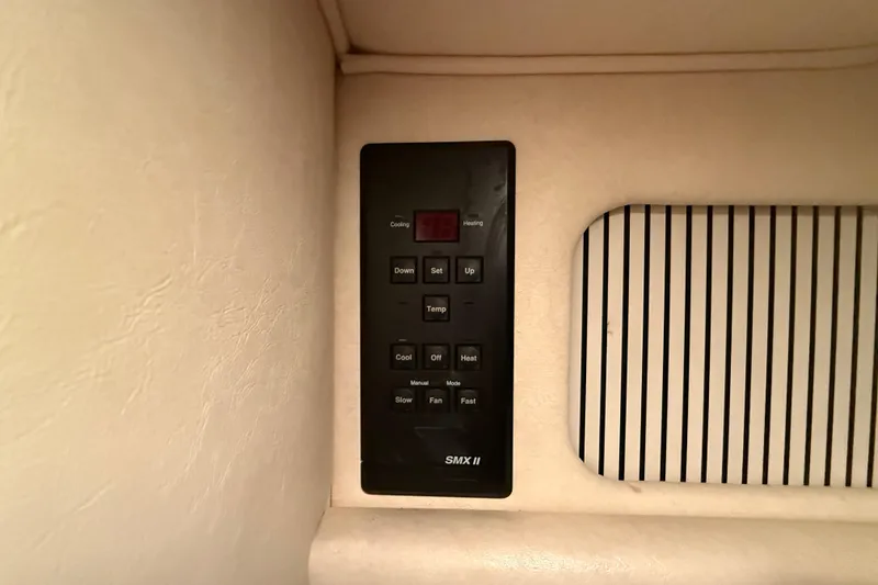 Slide: The Image of Control panel on a 2000 Sea Ray Sundancer 310 boat interior. - 46