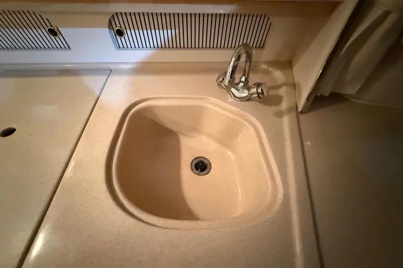 Slide: The Image of Sink area in 2000 Sea Ray Sundancer 310 boat interior. - 48